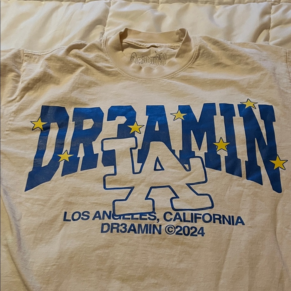 Clix Cream Graphic Tee with Blue and Yellow Design Los Angeles